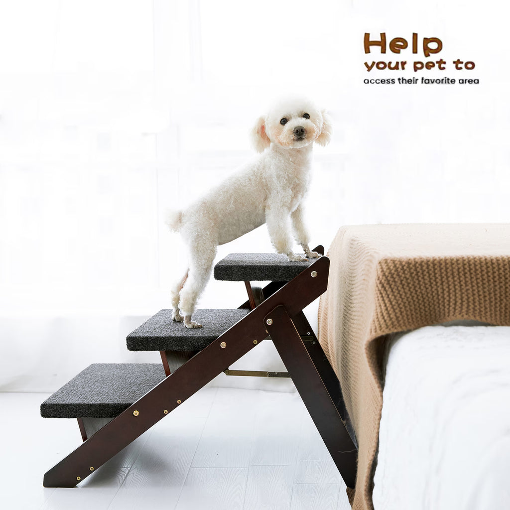 Small white dog standing on the wooden pet stairs beside a bed