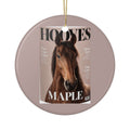 Round ornament with a magazine-cover pet portrait of a brown horse named Maple, hung on a gold string